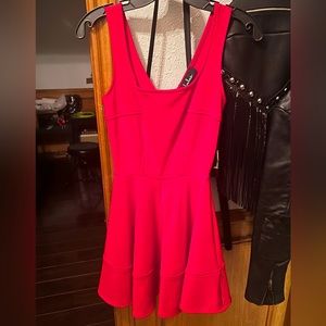 Bright red sleeveless dress! 👗 top half fitted bottom half not